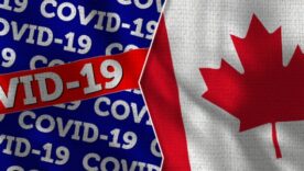 COVID-19 written on left on blue and red material with the Canada flag on the right. The images are separated by a white jagged line down the middle