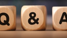 Three wooden blocks with Q & A written on them