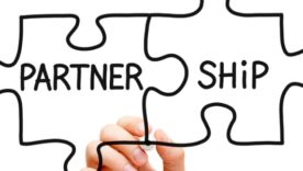 Two pieces of puzzles drawn with a marker, one has partner written on it and the other ship to read partnership