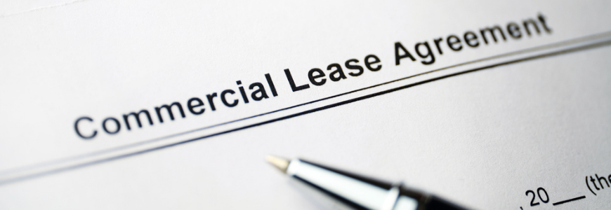 Commercial Lease Agreement document with a pen in the foreground