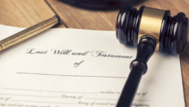 Will and Testament with a legal gavel and a pen on a desk