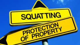 Traffic sign with two options - Squatting vs Protection of Property