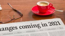A newspaper on a wooden desk - Changes coming in 2021