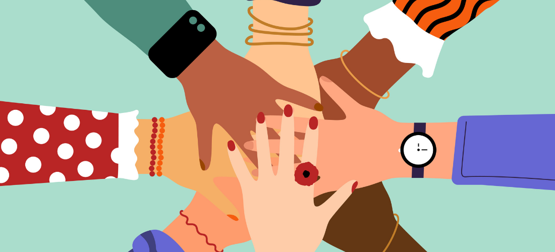 Hands of diverse group of people stacked together
