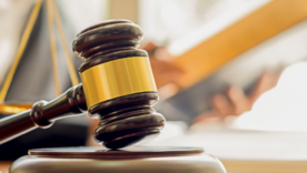 judge court gavel with judge faded in background