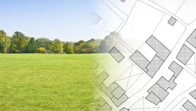 Planning a new city - concept image with hand drawing an imaginary cadastral map of territory with buildings, fields and roads against a green area