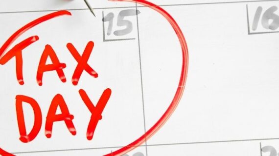Tax Day inscription on a calendar board