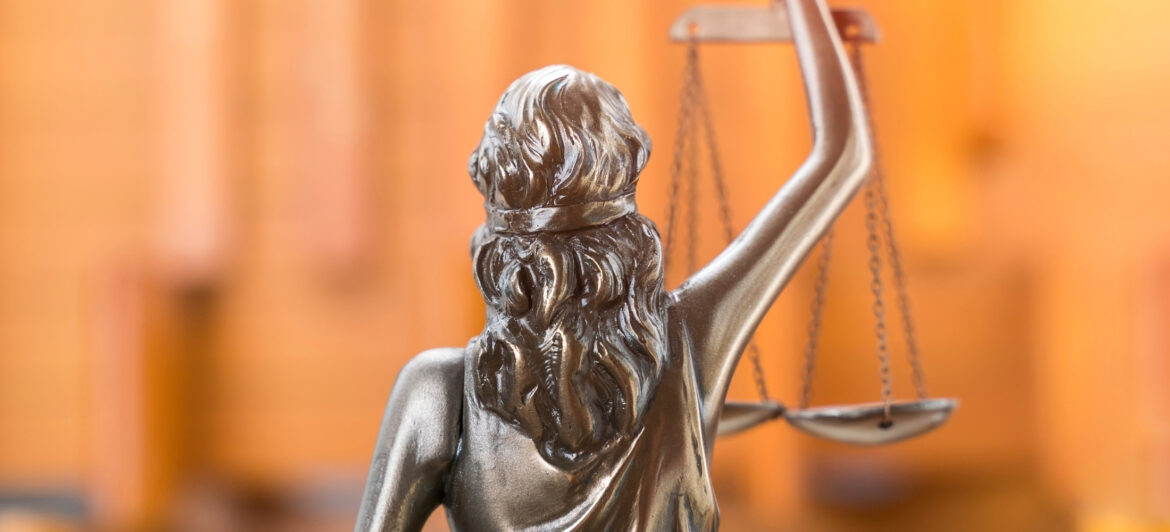Lady justice with a blurred orange background