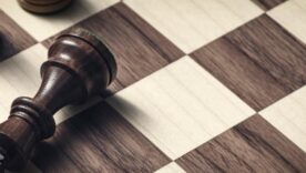 Chess strategy game: the black king is checkmated and defeated