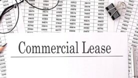 Paper with Commercial Lease on a table with chart