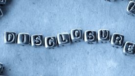 Disclosure - Word from Metal Blocks on Paper - Concept Photo on Table