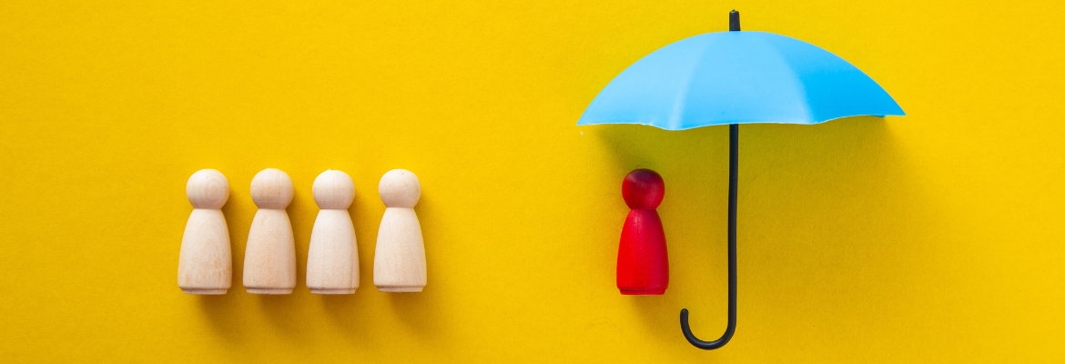Blue toy umbrella and wooden doll figures
