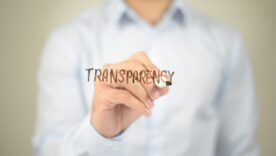 Transparency, Man writing on transparent screen.