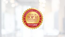 Canadian Lawyer 2025-26 Top 10 Ontario Regional Firm logo on a blurred background