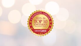 Canadian Lawyer 2025-26 Top 10 Ontario Regional Firm logo on a blurred background