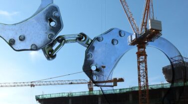 Handcuffs on construction site , crime concept