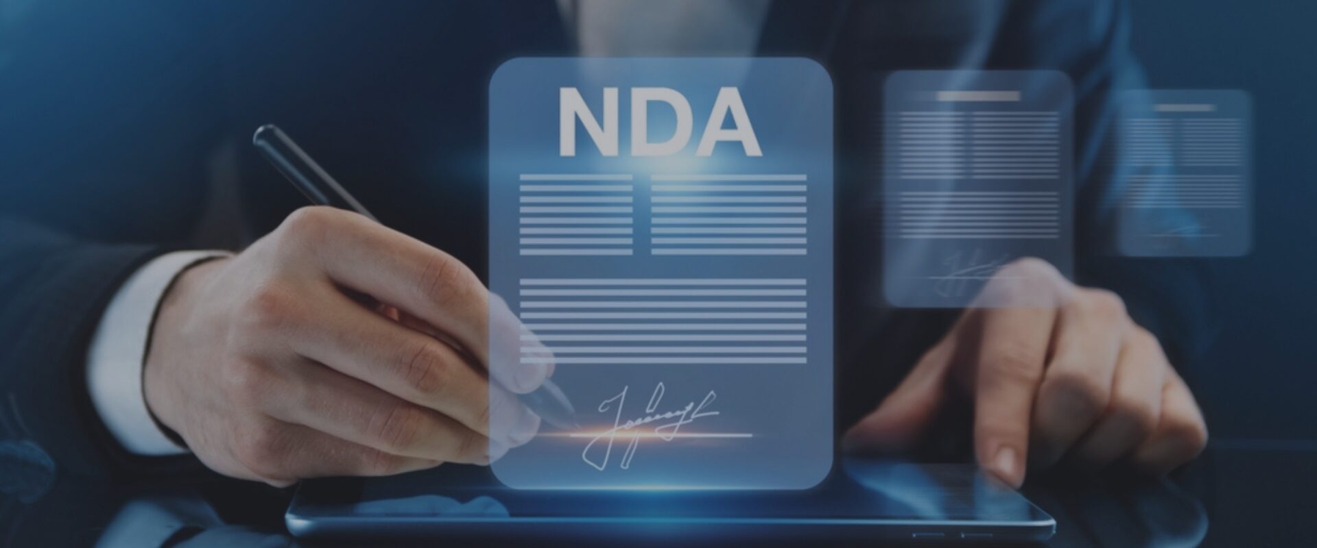 A person in a suit signing a digital Non-Disclosure Agreement (NDA) on a tablet, with the document displayed prominently.
