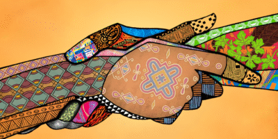 Two artistic hands, adorned with intricate patterns and colors, reaching out to each other against a warm orange background.