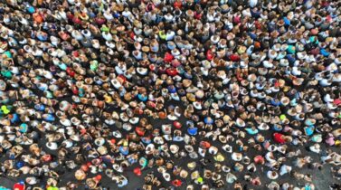 Aerial view of a large crowd gathered on a street