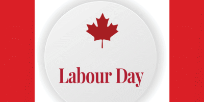A white circle with red text "Labour Day" and a red maple leaf, flanked by red vertical stripes, symbolizing Canada.