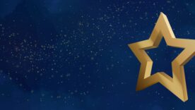 Gold star on a blue background with muted gold glitter to depict award concept