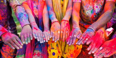Colourful hands depicting the Holi celebration