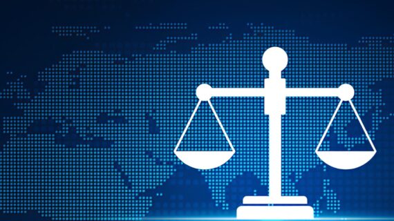 Digital scales of justice icon over a blue pixelated world map background, symbolizing global law and balance.
